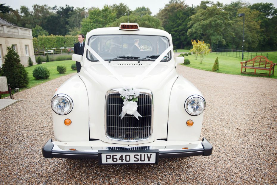 White wedding Taxi at Botleys Mansion by JUliet Mckee Photography