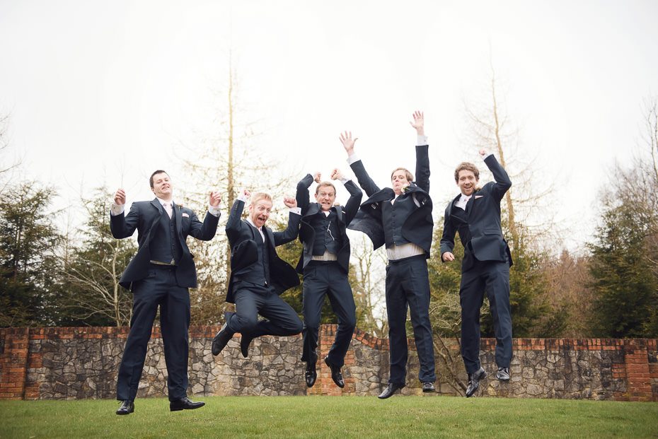 Grooms party leaping in the air