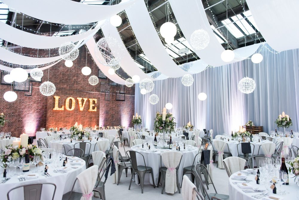 A white and sparkly industrial warehouse wedding venue