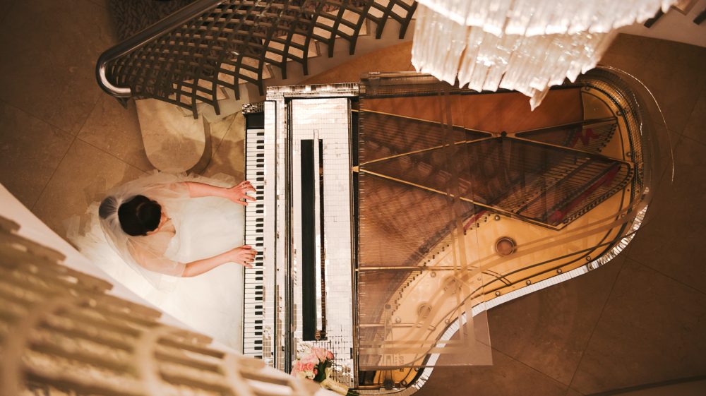 The bride plays the piano