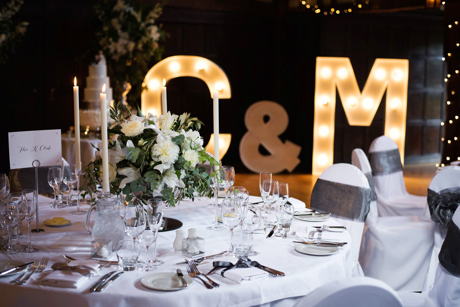 Elegant and stylish wedding table idea for a white wedding at Great Fosters Hotel.