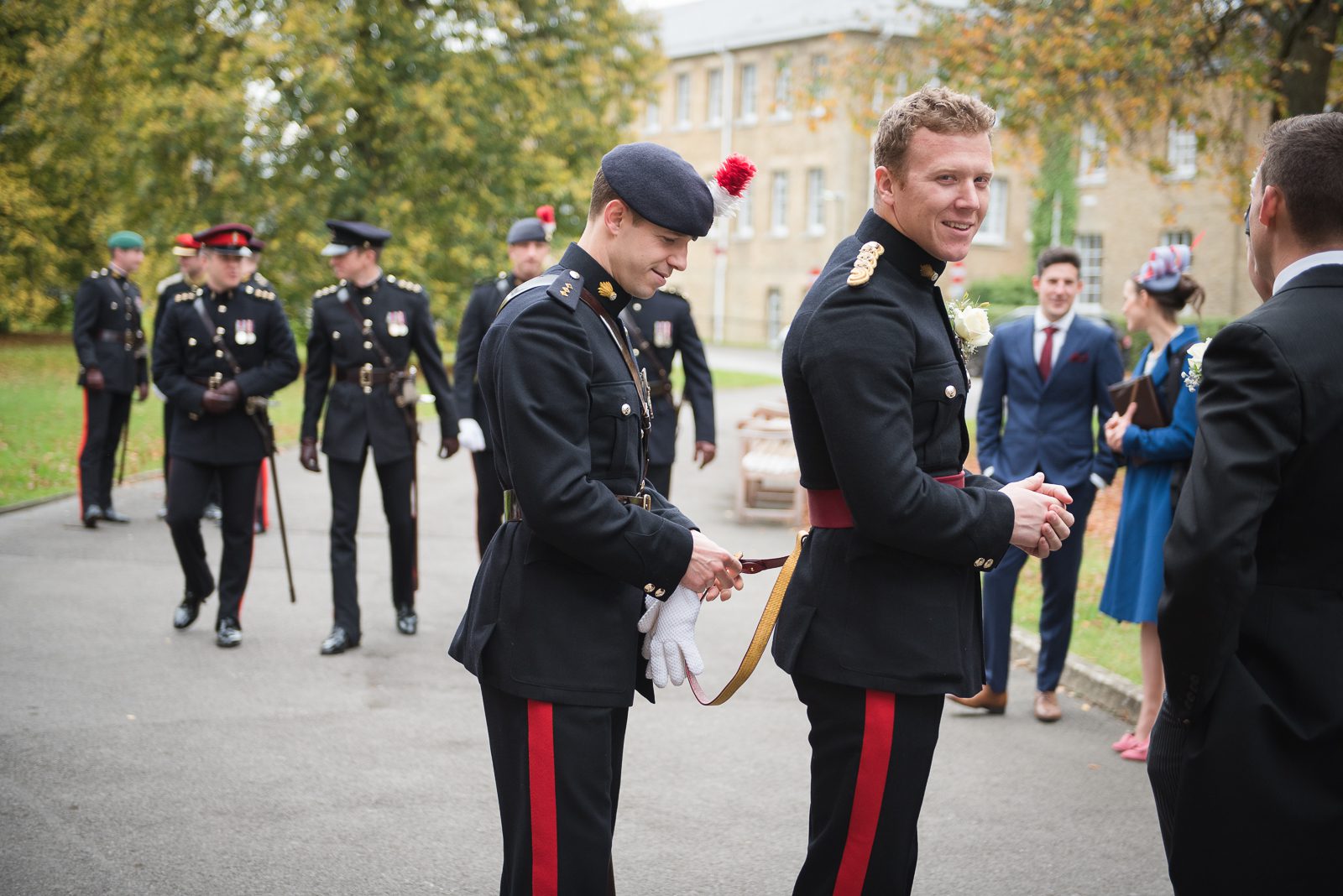 The groom wearing his Captain's uniform prepares for his church ceremony at RMAS.