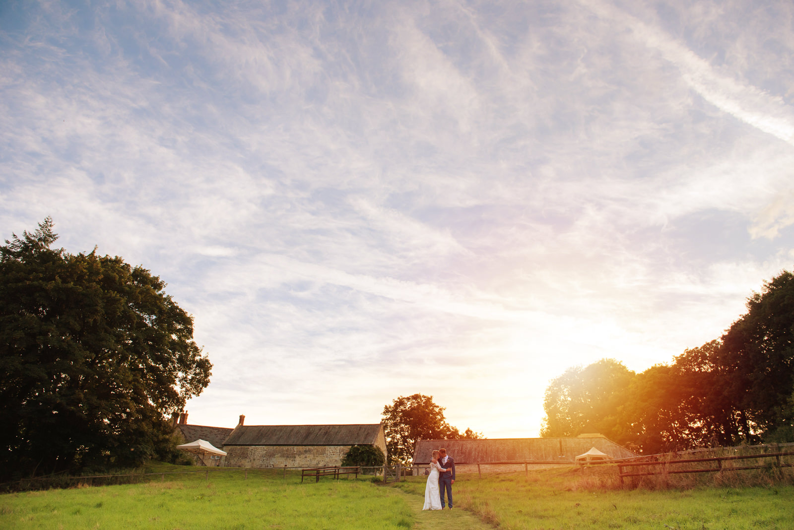 Beautiful bride and groom golden hour portraits at Ashley Wood farm in Wiltshire.