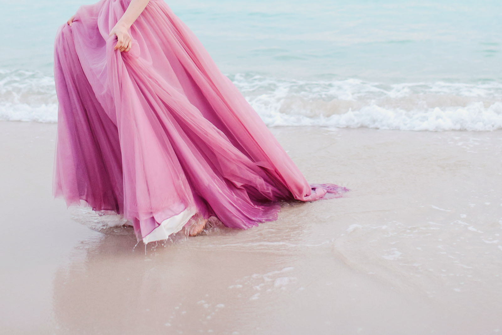 Tulle skirt in the breaking waves.