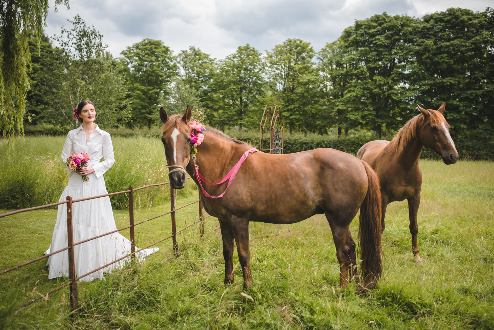 Bridal shoot by Juliet Mckee Photography featuring horses and florals.