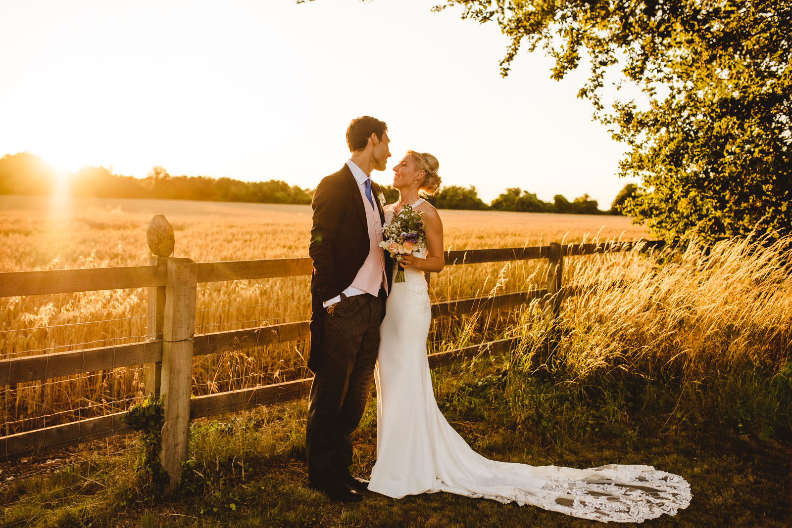 Beautiful golden hour wedding day bride and groom portraits Hampshire.