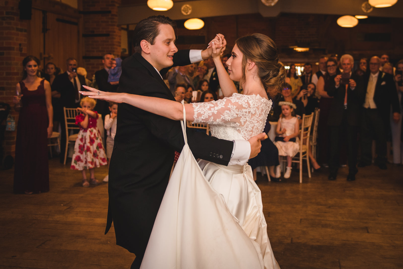 The first dance by ballroom dancing bride and groom.